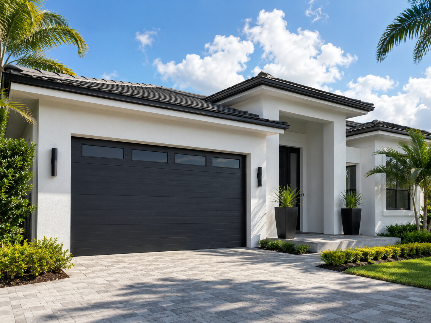 Modern home with two-tone garage doors